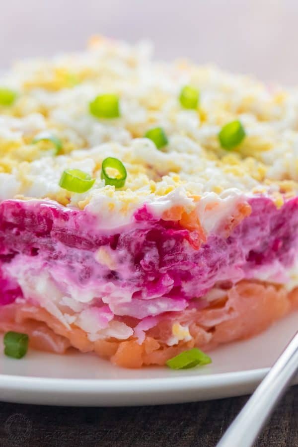 This Smoked Salmon Salad is our version of the classic Russian Shuba. This salmon layer salad is unique and absolutely delicious. WOW your dinner guests! | natashaskitchen.com