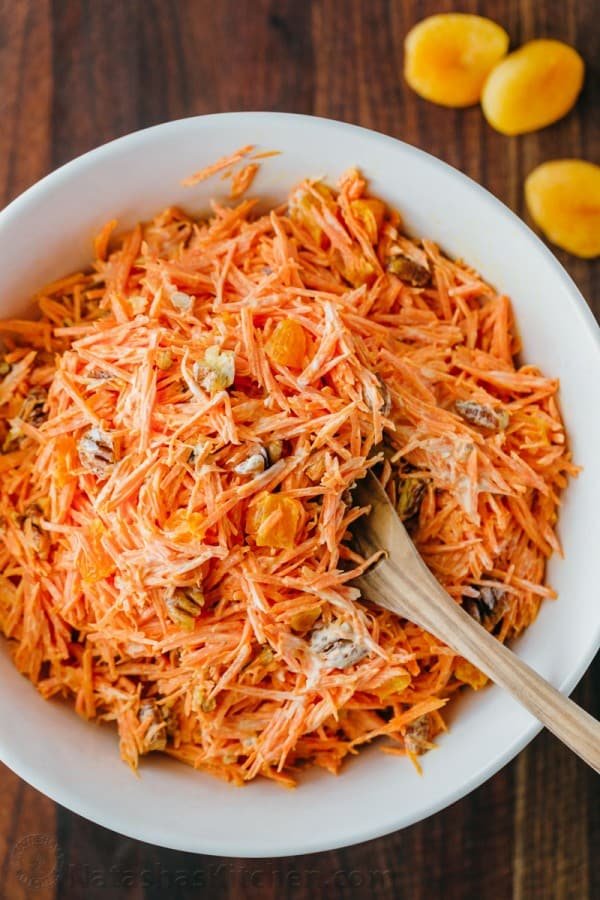A simple and tasty carrot salad studded with apricots and pecans. The dressing in this carrot salad is delicious - you'll want it on all of your salads! 