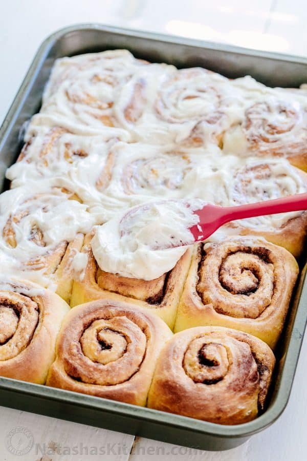 Melt-in-you-mouth overnight cinnamon rolls with whipped cream cheese icing. Perfect for holidays and busy mornings. The best make-ahead cinnamon rolls! | natashaskitchen.com