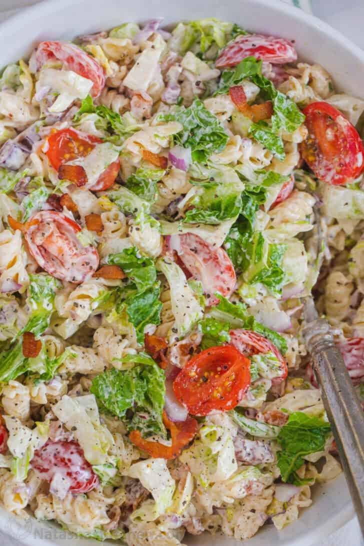 BLT pasta salad topped with ground black pepper. 