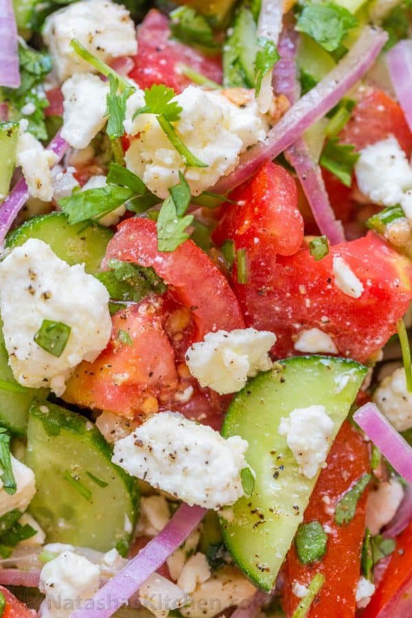 This Cucumber Tomato Feta Salad has simple ingredients that are a winning combination. Refreshing and flavorful! A new favorite cucumber tomato feta salad! | natashaskitchen.com