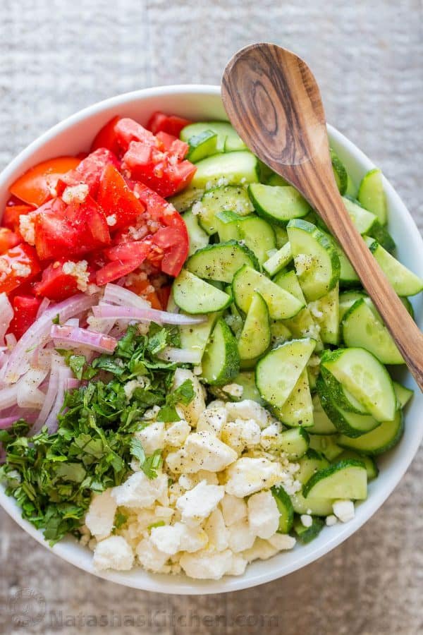 This Cucumber Tomato Feta Salad has simple ingredients that are a winning combination. Refreshing and flavorful! A new favorite cucumber tomato feta salad! | natashaskitchen.com