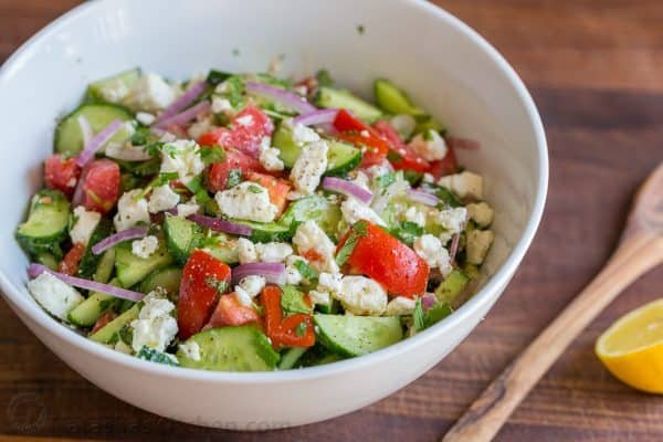 This Cucumber Tomato Feta Salad has simple ingredients that are a winning combination. Refreshing and flavorful! A new favorite cucumber tomato feta salad! | natashaskitchen.com