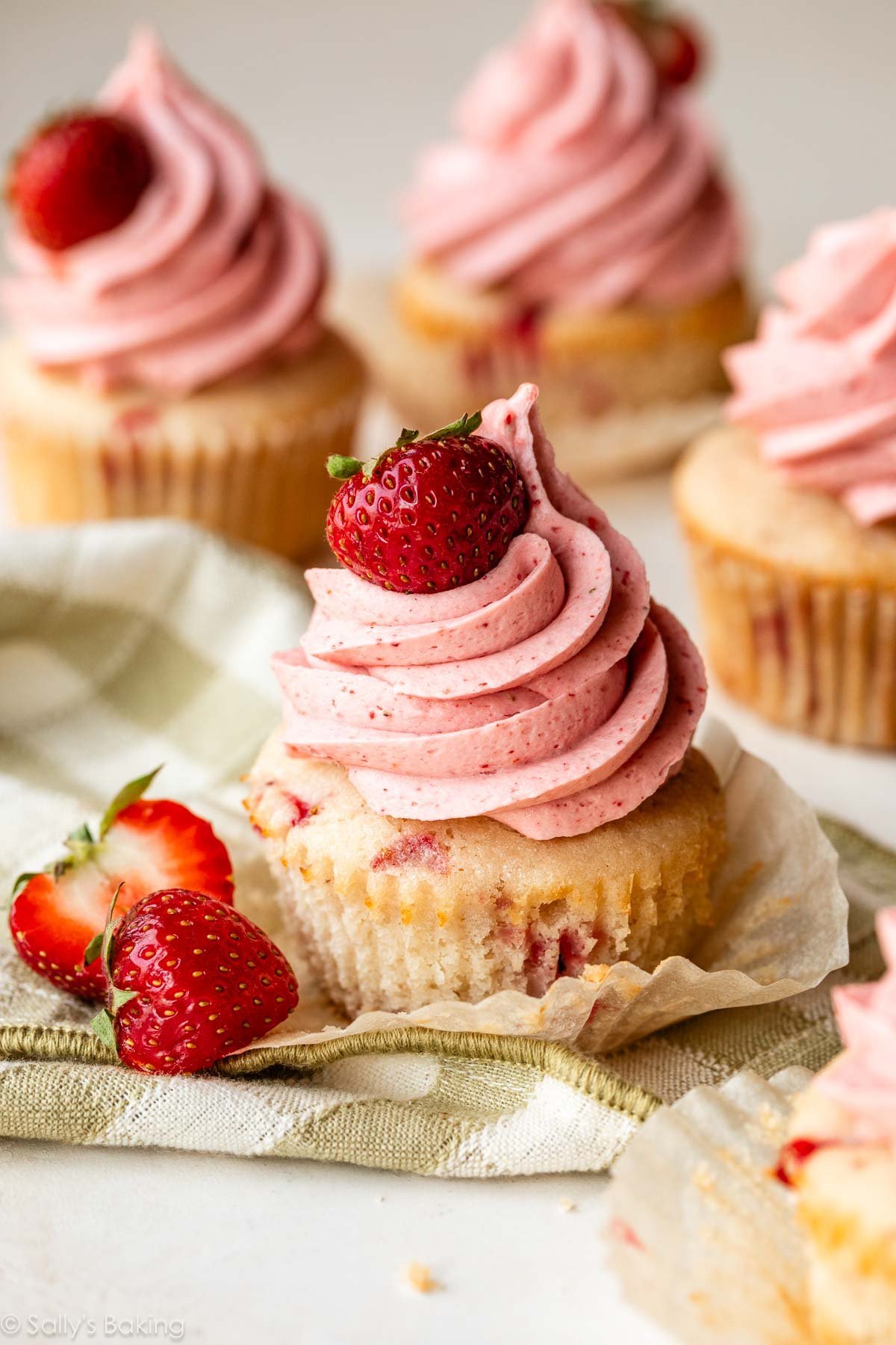 strawberry cupcake with piped strawberry buttercream.
