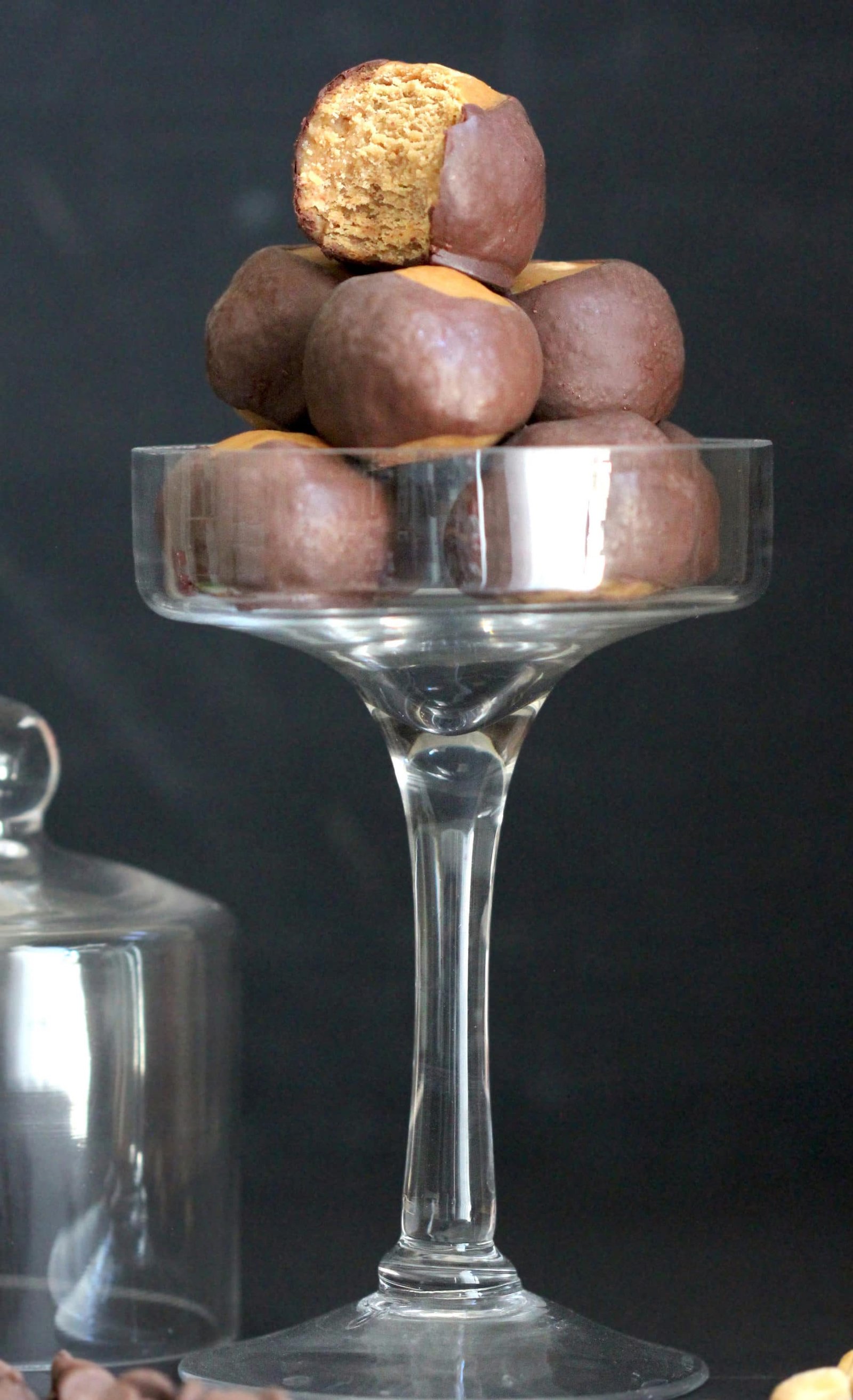 These Healthy Buckeye Balls are sweet and fudgy, peanut buttery orbs of magic surrounded by a layer of rich and decadent dark chocolate. It’s hard to believe they’re refined sugar free, low carb, high protein, and gluten free! Healthy Dessert Recipes at Desserts with Benefits