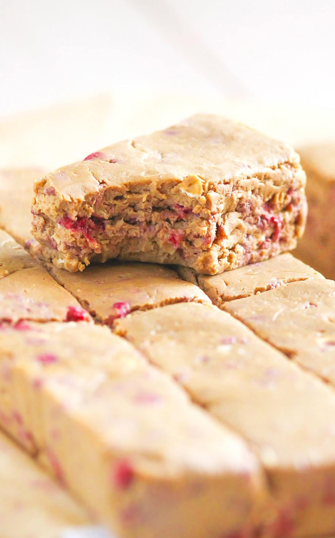 These easy, no-bake Healthy Peanut Butter & Jelly DIY Protein Bars are not only fudgy, sweet, and delicious, but sugar free, gluten free, and vegan too! Healthy Dessert Recipes with sugar free, low calorie, low fat, low carb, high protein, gluten free, dairy free, vegan, and raw options at the Desserts With Benefits Blog (www.DessertsWithBenefits.com)