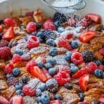 Croissant french toast casserole dusted with powdered sugar