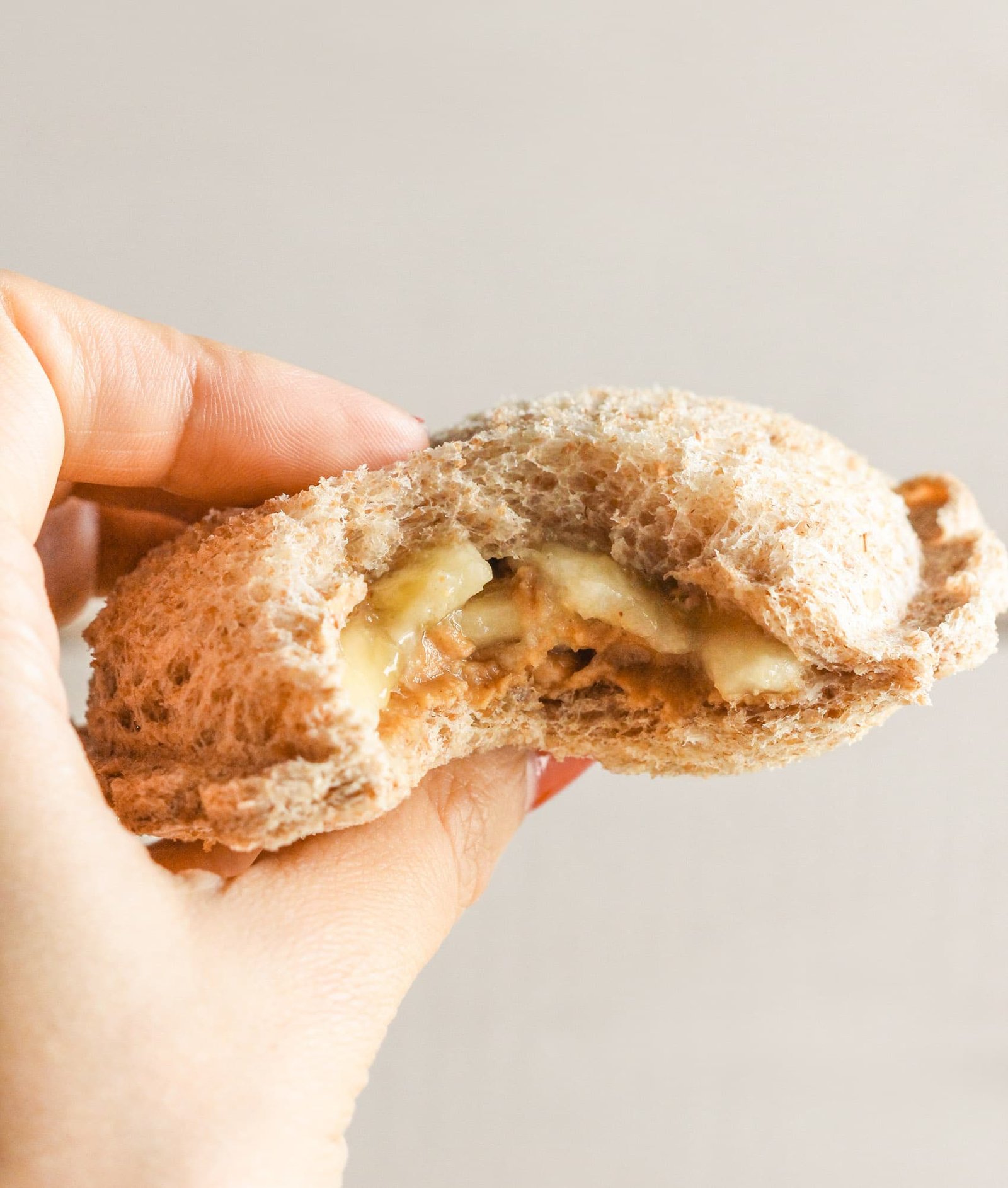 Uncrustables have been made BETTER (and healthier while we're at it)! These Healthy Homemade Peanut Butter Banana Uncrustables are all natural and whole grain with no sugar added. Far better than the original! Healthy Dessert Recipes with low calorie, low fat, high protein, gluten free, and vegan options at the Desserts With Benefits Blog (www.DessertsWithBenefits.com)