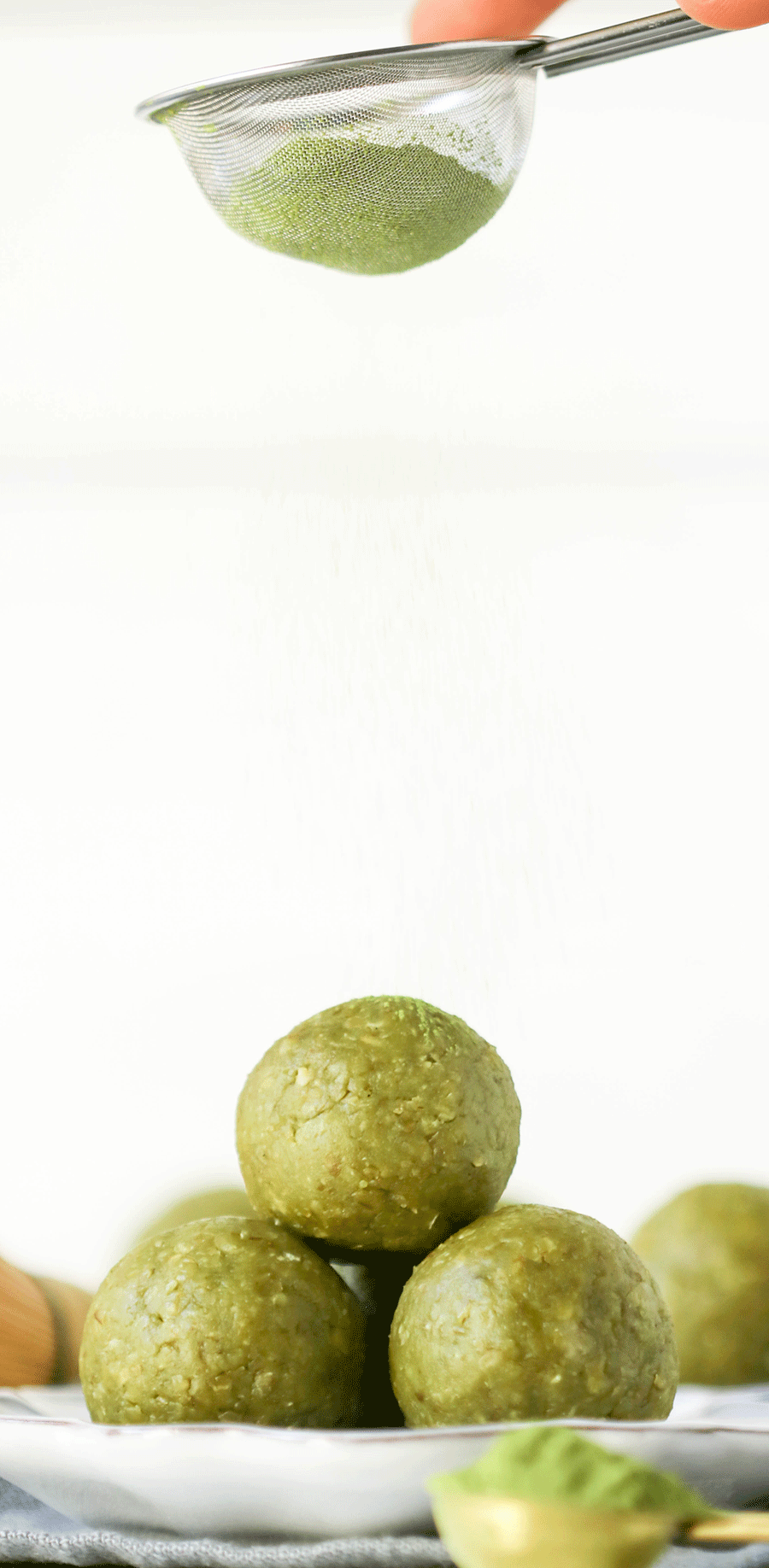 These Matcha Green Tea Energy Bites are soft, fudgy, sweet -- they're a real guilt-free treat. Made with nut butter, oats, and matcha powder. You'd never know they're sugar free, gluten free, dairy free, vegan, and keto-friendly too!