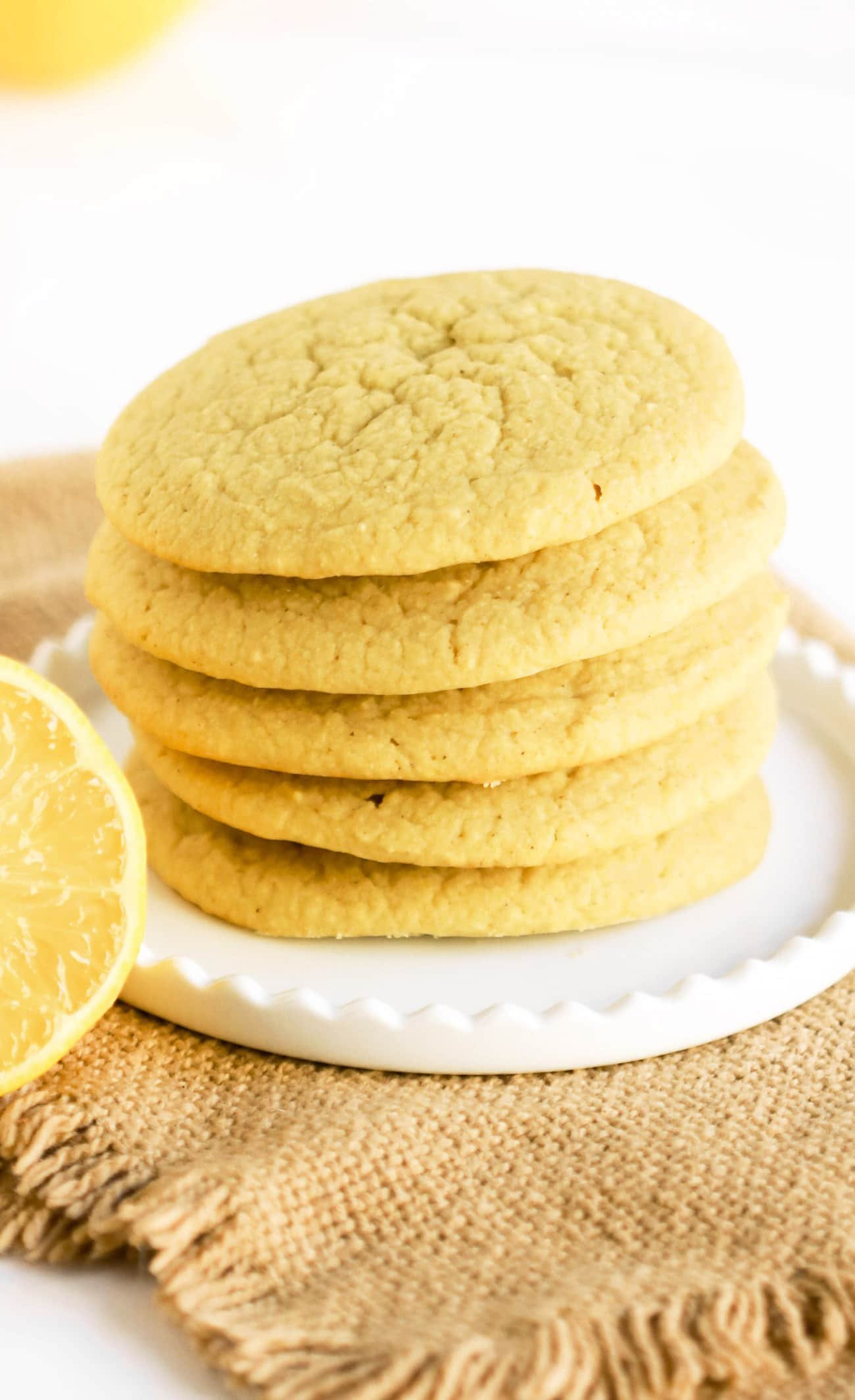 These Lemon Sugar Cookies are packed with bright and refreshing lemon flavor -- no need for the butter, sugar, or flour! Yes, these cookies are dairy free, sugar free, and gluten free. Perfect for the lemon lovers out there! Can you guess the secret ingredient that makes them uber soft?
