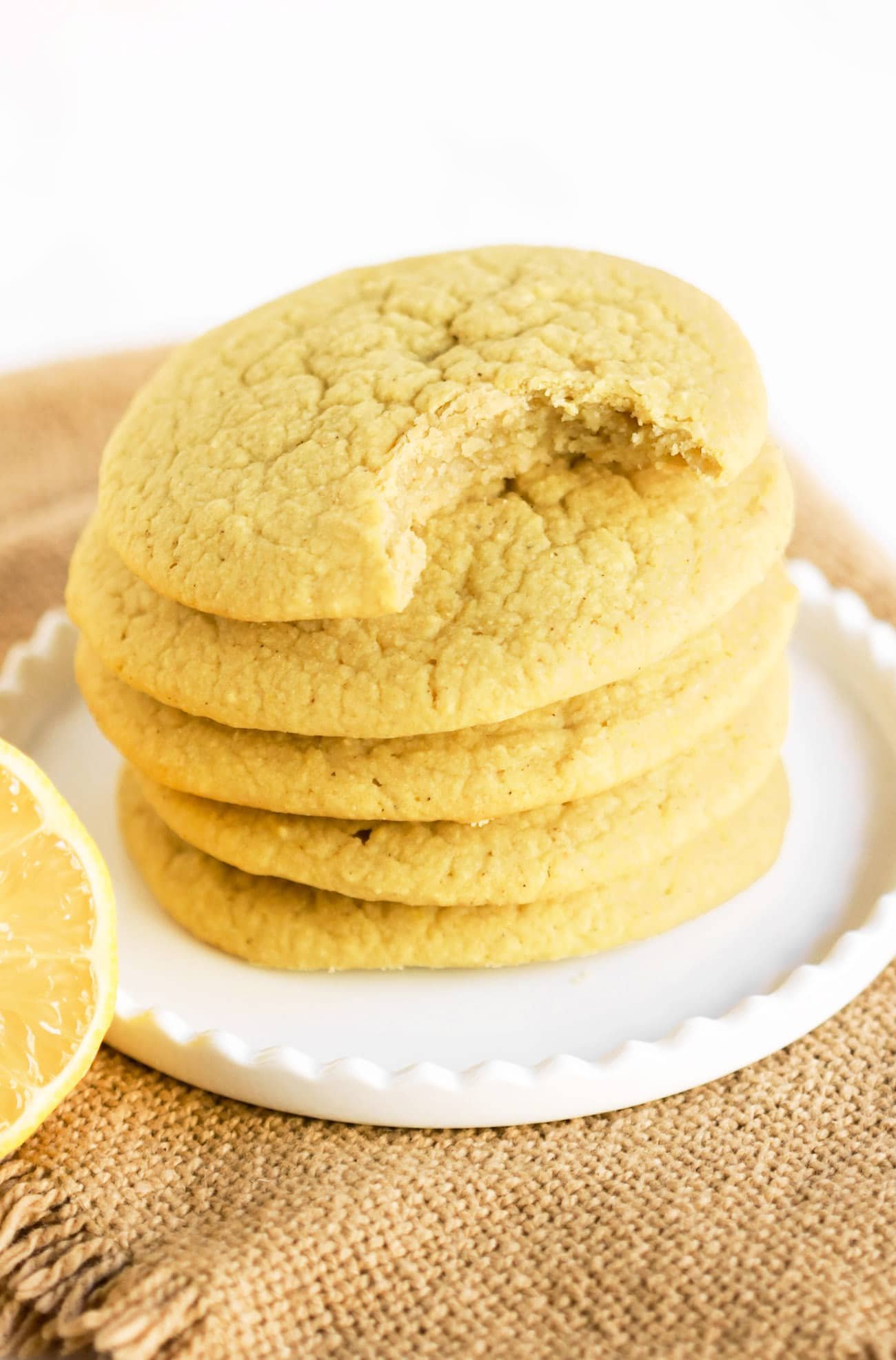These Lemon Sugar Cookies are packed with bright and refreshing lemon flavor -- no need for the butter, sugar, or flour! Yes, these cookies are dairy free, sugar free, and gluten free. Perfect for the lemon lovers out there! Can you guess the secret ingredient that makes them uber soft?