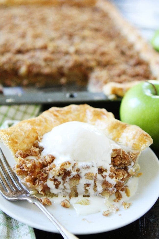 Apple Slab Pie with Crumb Topping Recipe on twopeasandtheirpod.com This easy apple pie is made in a jelly roll pan and is perfect for feeding a crowd. Add this pie to your Thanksgiving menu! It is sure to be a hit! Apple Slab Pie with Crumb Topping Recipe