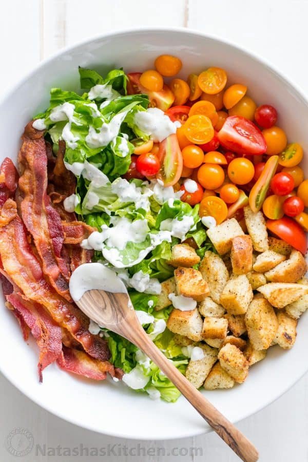 A BLT Salad loaded with fresh lettuce, crispy bacon, bright tomatoes, crunchy croutons and the BLT Salad dressing is exceptional. Easy, excellent salad! | natashaskitchen.com