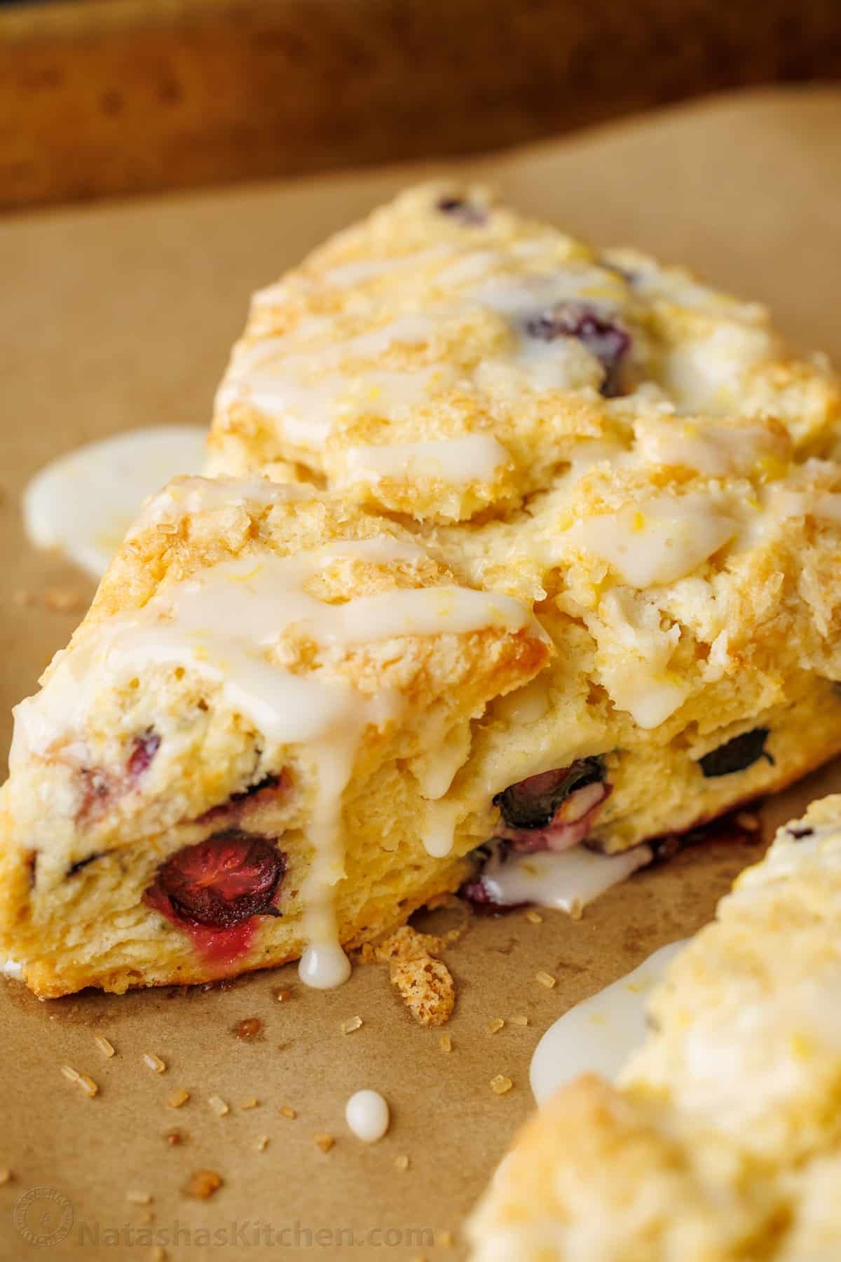 Blueberry scone drizzled with lemon glaze