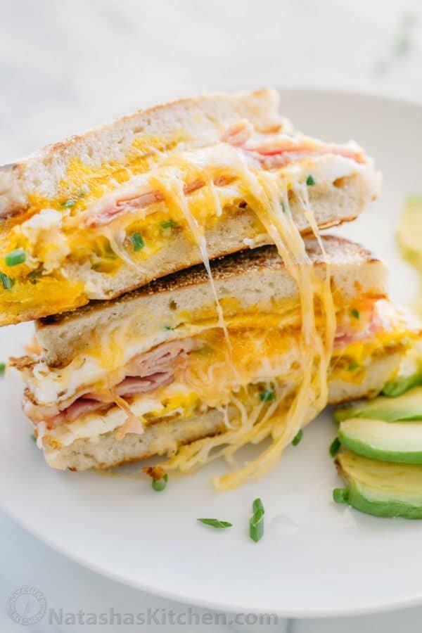 This breakfast sandwich is cheesy, juicy, easy and so delicious! All you need is 5 minutes and 5 ingredients. A one-pan breakfast sandwich recipe with video | natashaskitchen.com