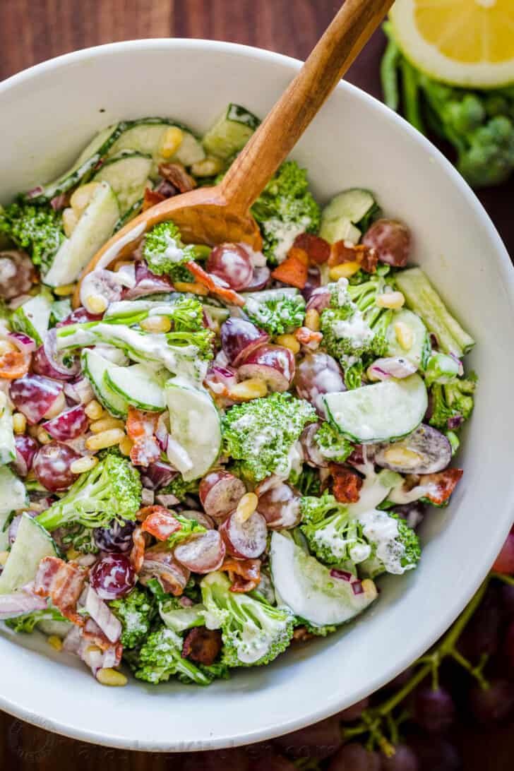 broccoli grape salad in a bowl with a serving spoon