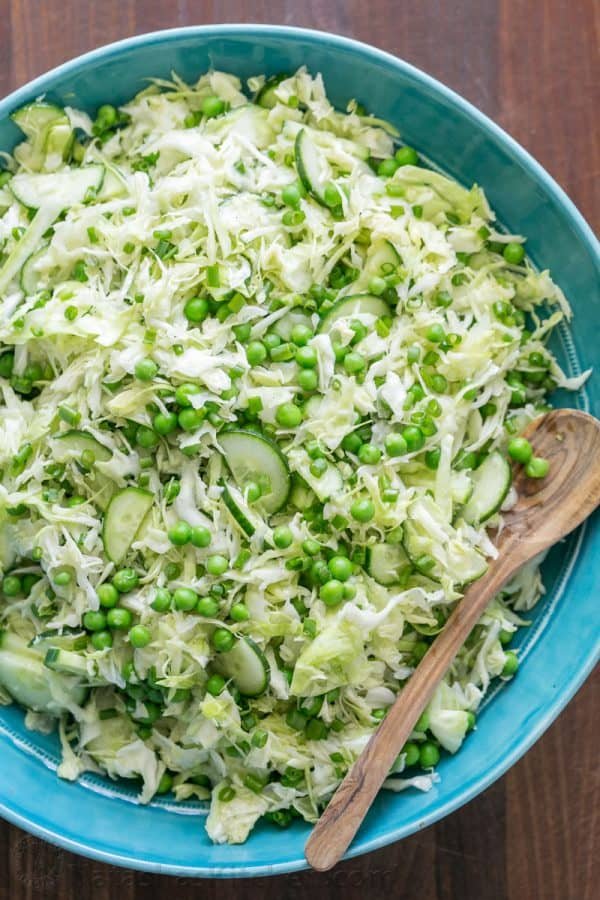 This cabbage and pea salad is vibrant, crisp and fresh. I love the sweet pop of flavor from the peas and the easy zesty dressing. A must try cabbage salad! | natashaskitchen.com