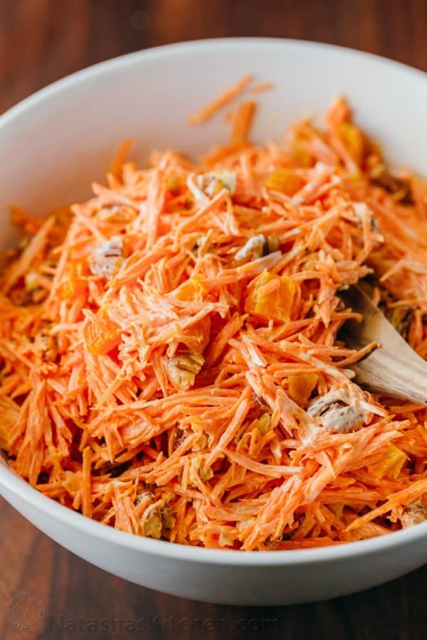 A simple and tasty carrot salad studded with apricots and pecans. The dressing in this carrot salad is delicious - you'll want it on all of your salads!