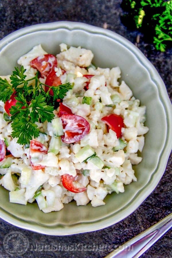A bowl do cauliflower, cucumber and tomato salad 