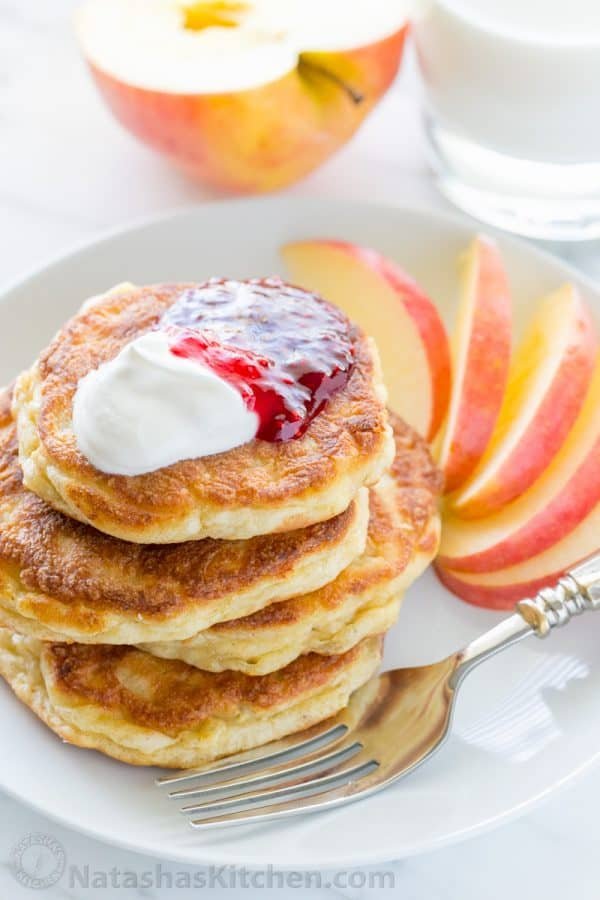 Apple and cheese pancakes are so light and fluffy. Serve these Ukrainian cheese pancakes with jam and sour cream for an unforgettable breakfast!