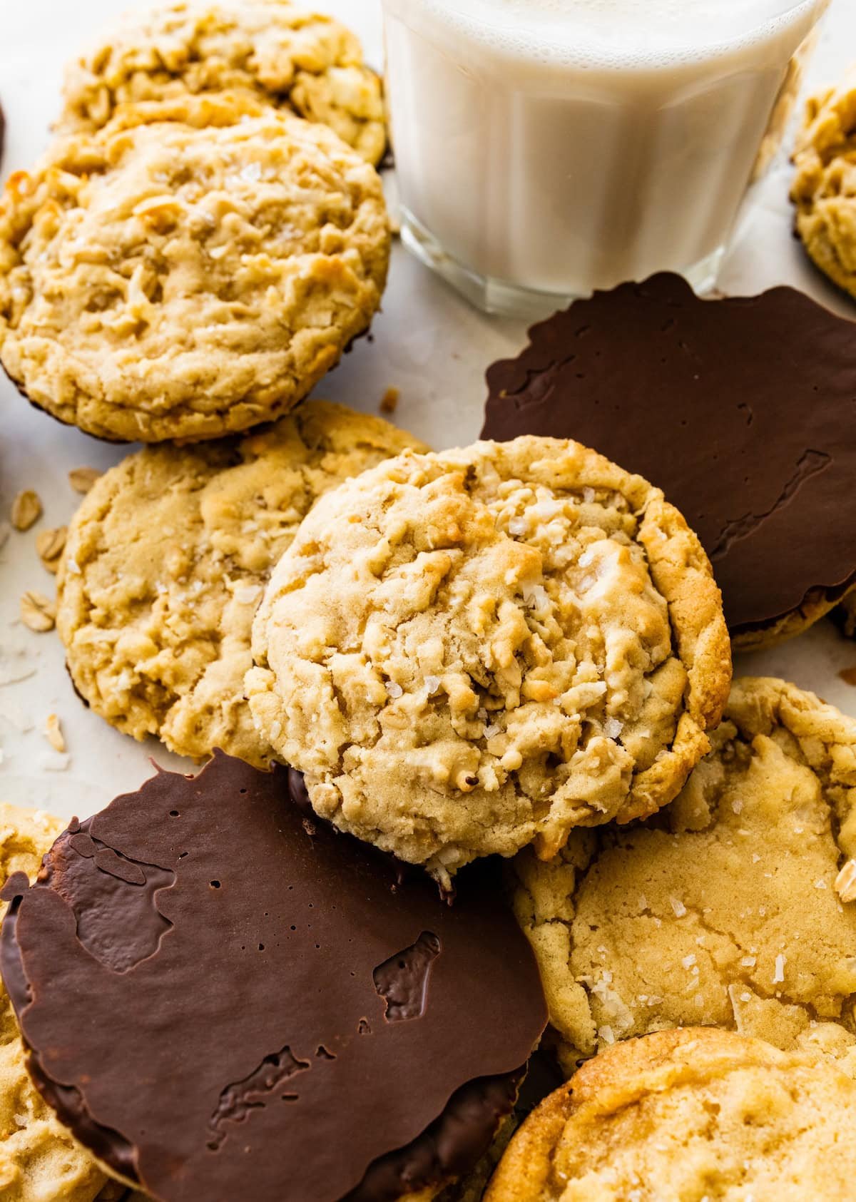 chocolate dipped coconut cookies with glass of milk.