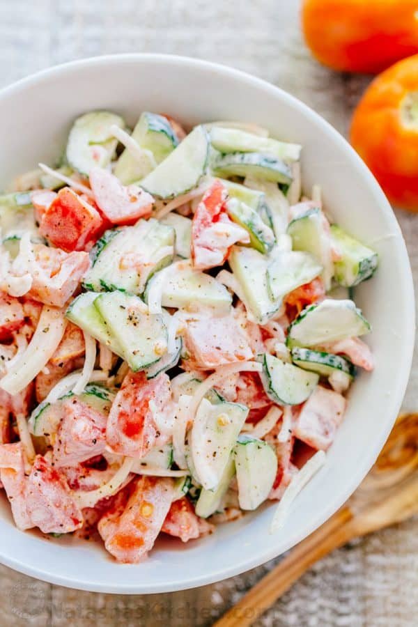 This CLASSIC creamy cucumber and tomato salad is so simple to make and is our go-to summer salad. An easy, excellent cucumber tomato salad. KEEPER! | natashaskitchen.com