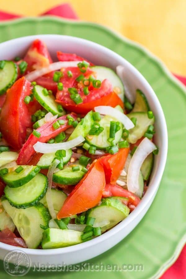 A bowl of cucumber and tomato salad 