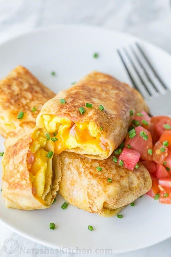 Egg, Ham and Cheese Crepes Pockets - Our son's favorite breakfast and they are freezer friendly! | natashaskitchen.com