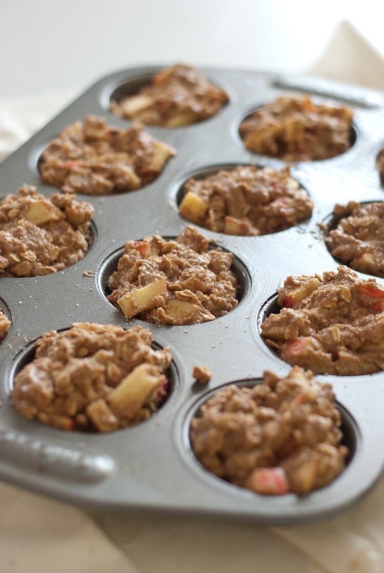 apple oatmeal muffins in muffin tin