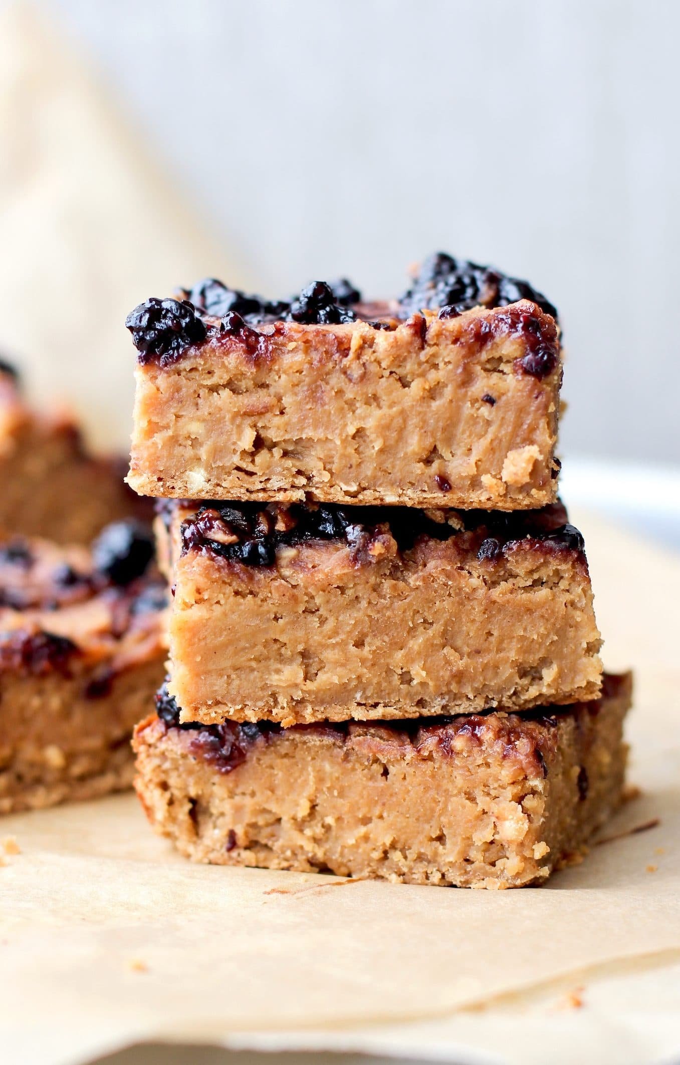 These Healthy Peanut Butter and Jelly Blondies are SUPER dense, fudgy, and rich. Also guilt-free, refined sugar free, high protein, gluten free and vegan! - Healthy Dessert Recipes at Desserts with Benefits