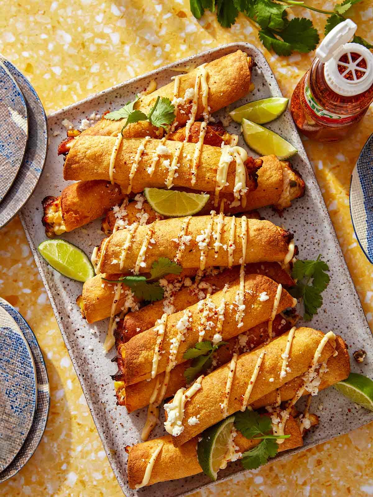 Homemade taquitos on a platter made with an air fryer.