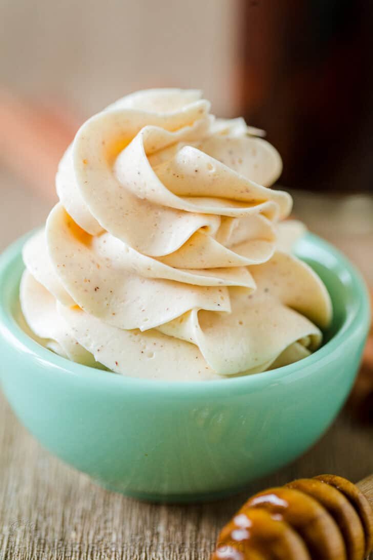 Honey butter piped into blue bowl