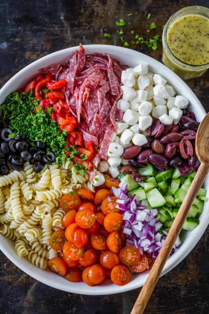 Italian pasta salad in serving bowl with Italian dressing