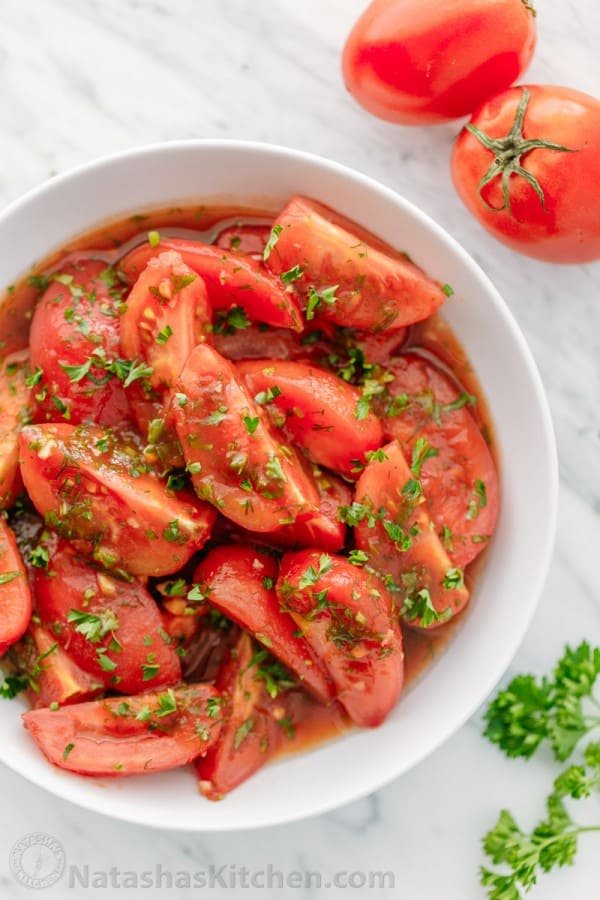 Addictively delicious! Served these marinated tomatoes at a potluck and everyone wanted the recipe! Marinated tomatoes are a great make-ahead side dish.