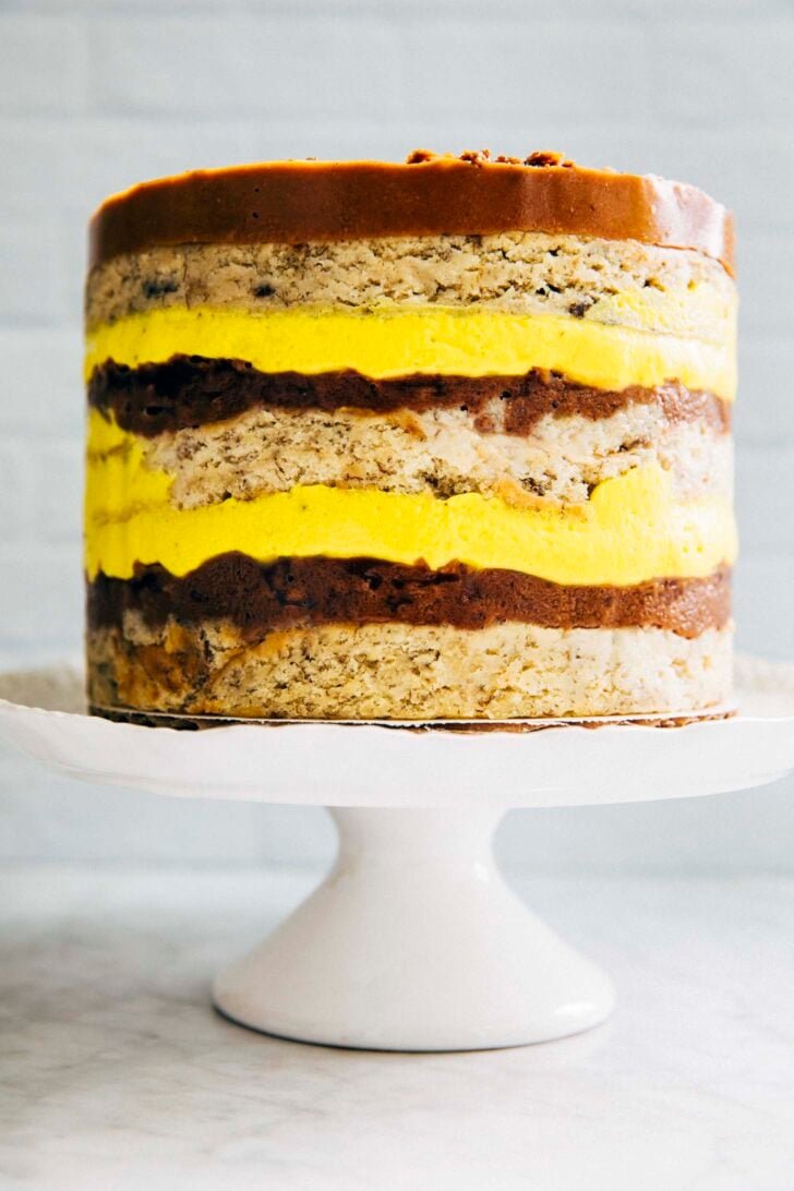 photo of milk bar banana layer cake on a white cake stand