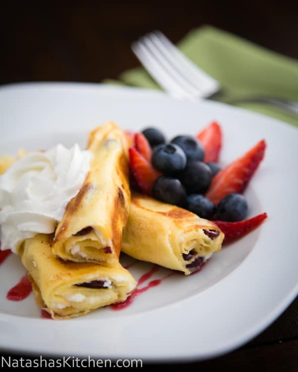 These Russian Crepes with cheese are our favorite breakfast and they can be prepared ahead of time; making it the ideal breakfast dish for company.