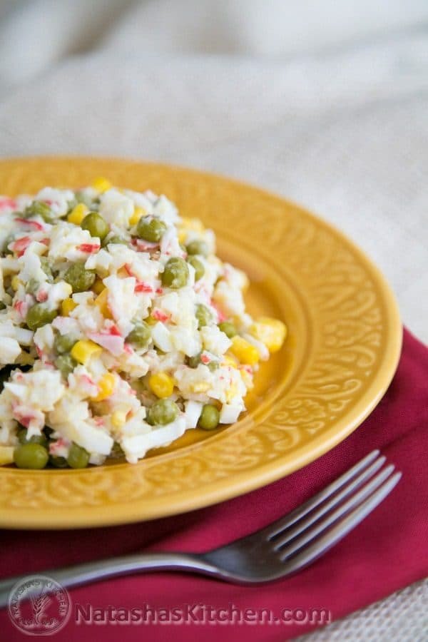 Crab salad on a yellow plate 