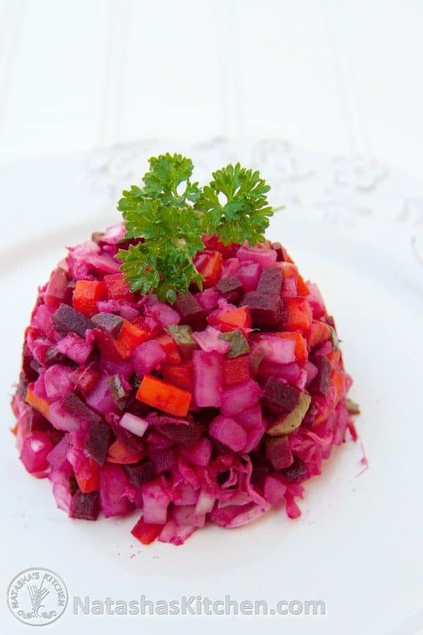 Russian vinaigrette salad with beets and sauerkraut on a white plate 