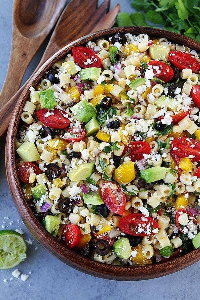 Southwest Pasta Salad is the BEST pasta salad recipe and perfect for potlucks, parties, and easy meals! #pasta #pastasalad #summer #tomatoes #dressing #sidedish #easyrecipe #dinner #vegetarian #salad Southwest Pasta Salad in bowl.