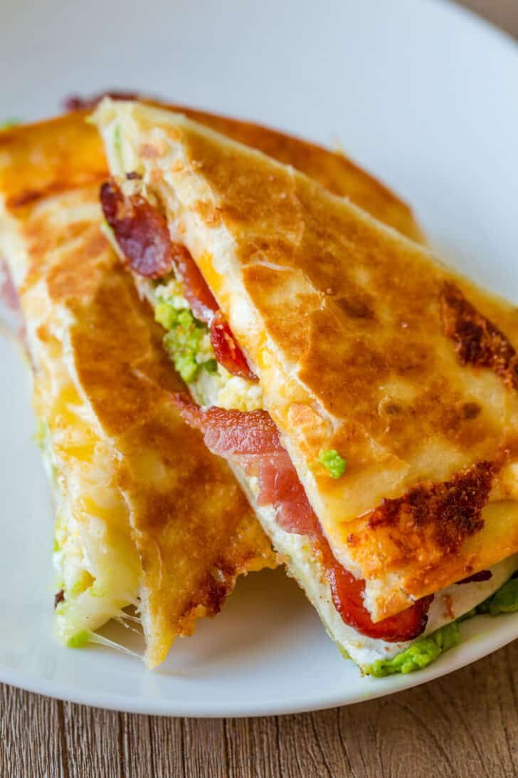 This EASY Breakfast Tortilla Fold technique went viral on TikTok and it's genius. It takes a regular Tortilla Breakfast Wrap to the next level. Breakfast tortilla fold served on a plate
