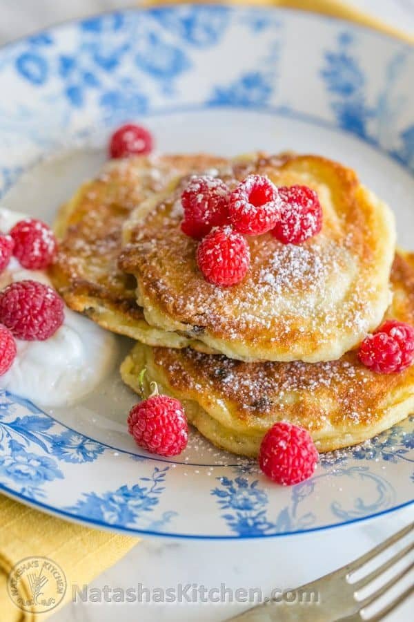 You must try these simple yet delicious Ukrainian syrniki with Farmer's cheese. They known as tvorog pancakes. Soft on the inside, golden outside. Yum!