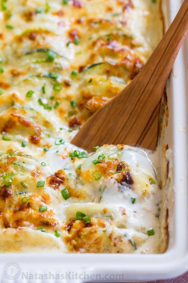 Creamy, cheesy Zucchini Potato Bake in a garlic Alfredo sauce. This potato bake recipe has simple ingredients, comes together quickly and tastes so good! | natashaskitchen.com