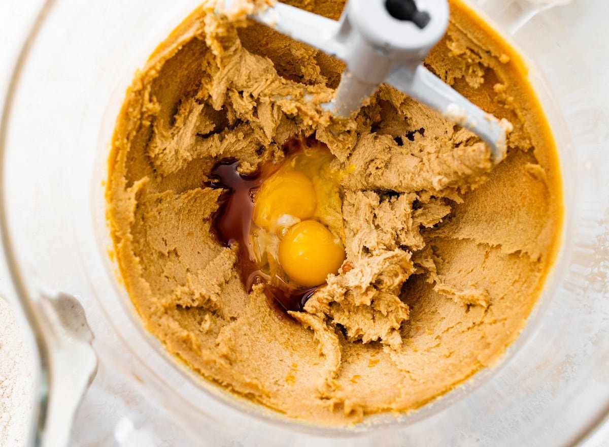 creamed butter and sugars in mixing bowl with eggs and vanilla extract.