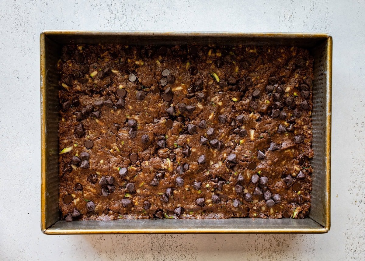 zucchini brownie batter in pan. 