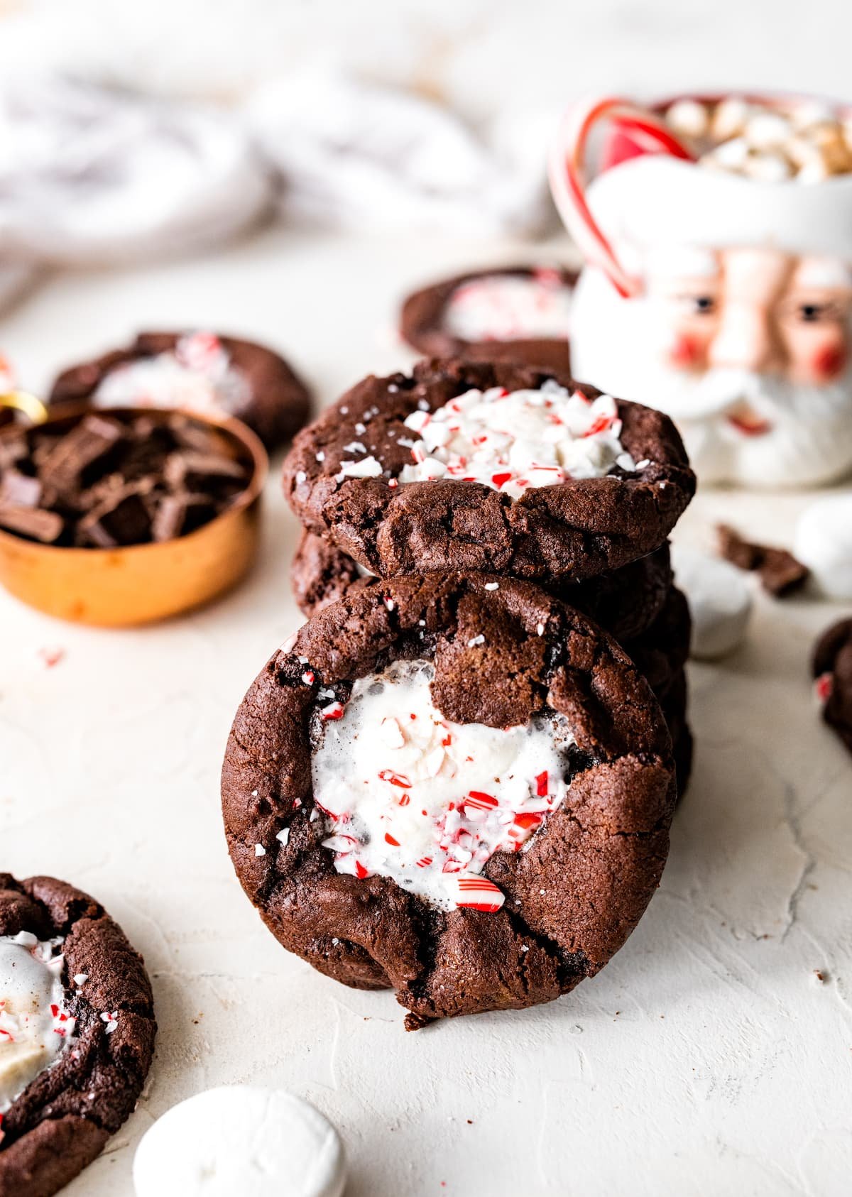 stack of peppermint mocha marshmallow cookies with one cookie leaning on the stack.