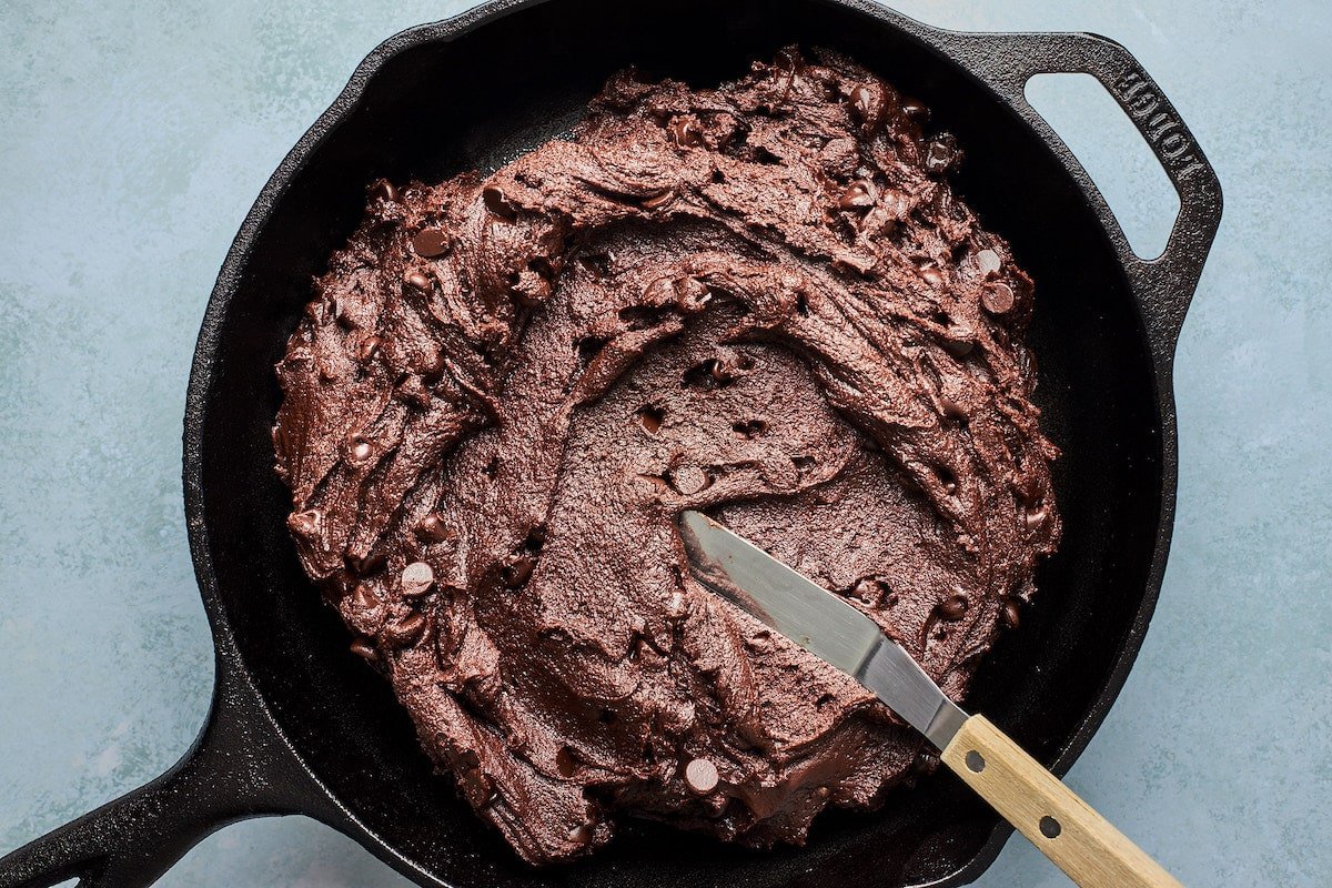 Andes mint cookie dough in skillet with spatula. 