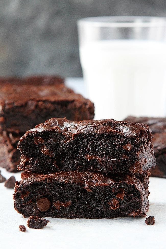 fudgy brownies stacked on top of each other. 