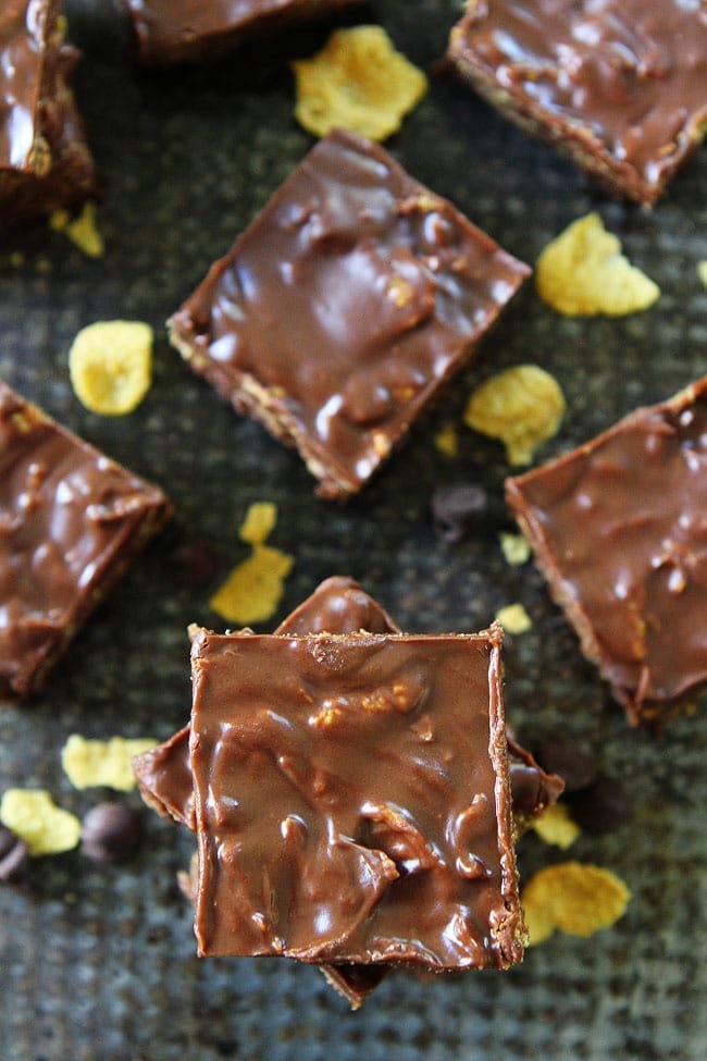 Crunchy No-Bake Chocolate Peanut Butter Bars Recipe on twopeasandtheirpod.com These bars are SO easy to make at home and are better than any store bought candy bar! They are our favorite easy treat! Crunchy No-Bake Chocolate Peanut Butter Bars Recipe