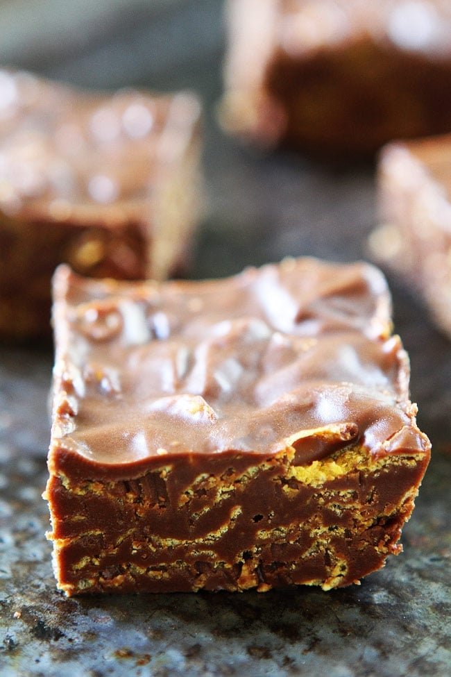 Crunchy No-Bake Chocolate Peanut Butter Bars Recipe on twopeasandtheirpod.com These bars are SO easy to make at home and are better than any store bought candy bar! They are a family favorite! Crunchy No-Bake Chocolate Peanut Butter Bars Recipe