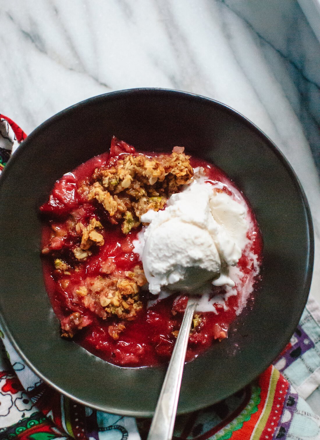 Simple, gluten-free plum crisp with a pistachio, oat and almond meal topping 